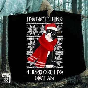 May include: Black t-shirt featuring a cat wearing a Santa hat and a red scarf. The cat is surrounded by a white snowflake pattern. The text reads "I DO NOT THINK THEREFORE I DO NOT AM."