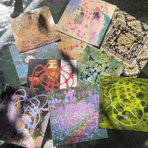 May include: A collection of square art prints with various abstract and nature-inspired designs. The prints feature a range of colors, including pink, green, purple, and brown, with intricate patterns and illustrations. Some prints have a collage-like appearance.