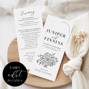 May include: Two white wedding ceremony programs with black text, featuring the names "Juniper and Finnias" and ceremony details. A round black sticker with "Easily edit in Canva" is visible. The programs are on a wooden surface.