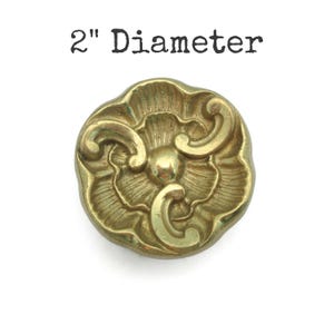 May include: A set of three ceramic nesting bowls in shades of blue, green, and white. The bowls feature a speckled glaze and a simple, modern design. The largest bowl measures approximately 6 inches in diameter.