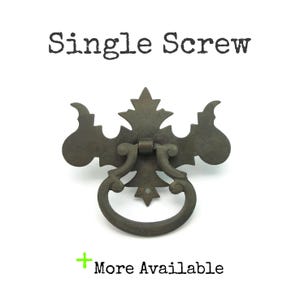 May include: A set of three ceramic mugs with a speckled, matte finish. The mugs are in shades of cream, light gray, and dark gray. Each mug has a simple, minimalist design and a rounded handle.