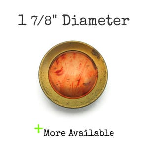 May include: A set of three ceramic mugs with a speckled, matte finish. The mugs are in shades of cream, light gray, and dark gray. Each mug has a simple, minimalist design, perfect for coffee or tea.