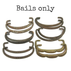 May include: A collection of eight metal drawer bails in various finishes and textures, arranged in pairs. The bails feature curved designs with embossed patterns, rope-like textures, and smooth surfaces. The text Bails only is visible above.