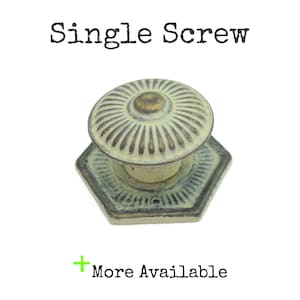 May include: A single antique-style cabinet knob with a cream and bronze finish. The knob has a circular, ridged top and a hexagonal base. Text on the image reads "Single Screw" and "More Available".
