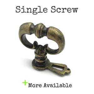May include: A single antique brass-colored screw with a decorative handle. The screw has an ornate design with a keyhole-shaped base and the text "Single Screw" above it. The text "More Available" is also present.