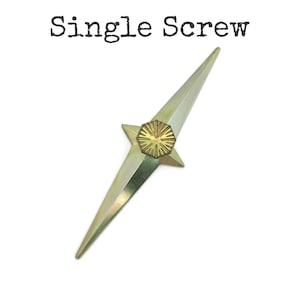 May include: A metallic gold-colored screw with a star-shaped head and a pointed end. The head features a circular, sunburst-like design. The text "Single Screw" is printed above the screw.