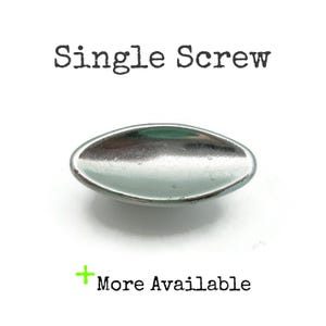 May include: A single, oval-shaped silver screw is centered on a white background. The text "Single Screw" is above the screw, and "More Available" is below it, in a green plus sign.