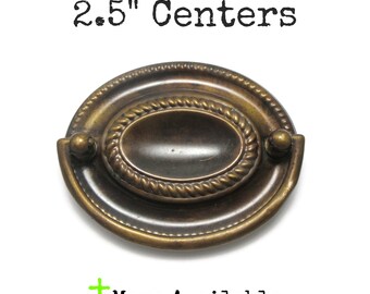 Vintage Drawer Pull 2.5" centers Ornate Oval Hepplewhite Aged Brass colored pressed metal handle