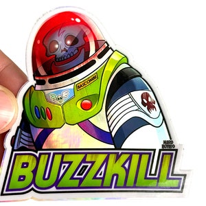May include: A holographic sticker featuring a cartoon illustration of Buzz Lightyear with a skull face. The sticker has the text "Buzzkill" and "Hard Boiled" in green and purple lettering.