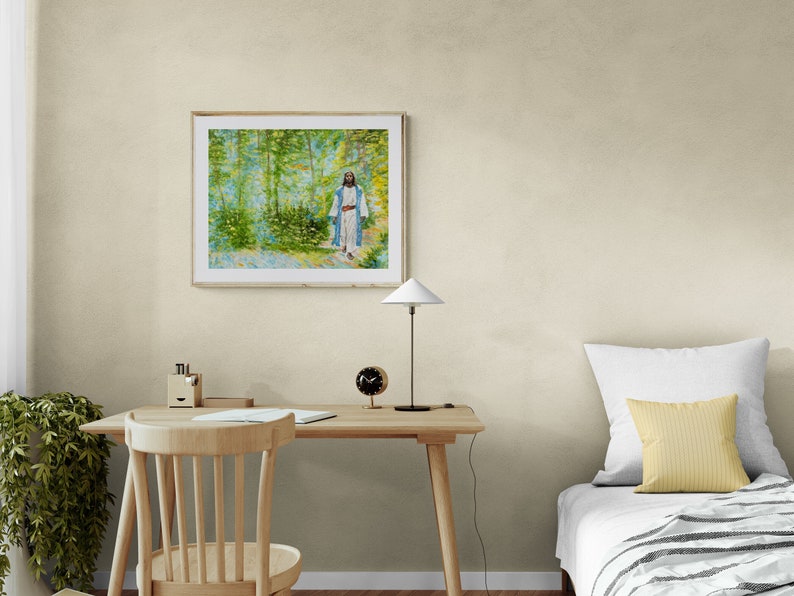 May include: A framed painting of a person walking through a forest. The painting is in a light wood frame and is hanging on a light beige wall.