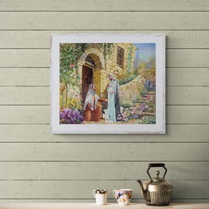 May include: A framed painting depicting a religious scene. Two figures are in front of a stone building with an arched doorway. The scene is filled with flowers and greenery, with a warm, inviting color palette.