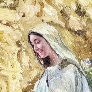 May include: Oil painting of a woman with dark hair and a light-colored head covering, smiling gently. The artwork features a warm color palette with shades of yellow, brown, and green, creating a soft and serene atmosphere. The brushstrokes are visible, adding texture.