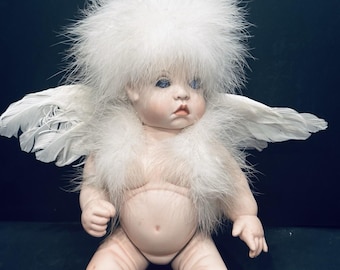 Unusual angel baby doll with wings_