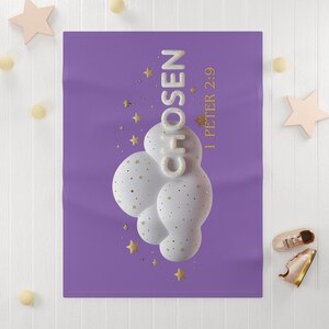 May include: A purple blanket with the word "CHOSEN" in white, gold stars and the text "1 PETER 2:9". The blanket features a white, cloud-like design with gold speckles.