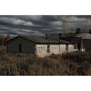 Menor's Cabin Matted photograph of William Menor's homestead in the Grand Tetons National Park. image 1