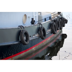 Raven -  Matted photograph of a tug boat in Tarpon Springs, Florida