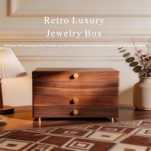 May include: A wooden jewelry box with three drawers and gold-colored knobs and feet. The box has a rich, dark wood grain and the text "Retro Luxury Jewelry Box". The design is vintage and luxurious.
