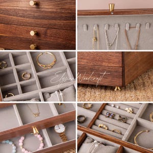 May include: A wooden jewelry box with multiple drawers and compartments. The box is made of dark wood and features gold-colored hardware. The interior is lined with gray fabric, and various pieces of jewelry are displayed, including rings, necklaces, and bracelets.
