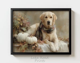 May include: A framed print featuring a golden retriever wearing a plaid scarf, resting near white pumpkins and autumn leaves. The artwork has a vintage aesthetic, with soft colors and a warm, inviting feel. The text "Lake Road Prints" is at the bottom.