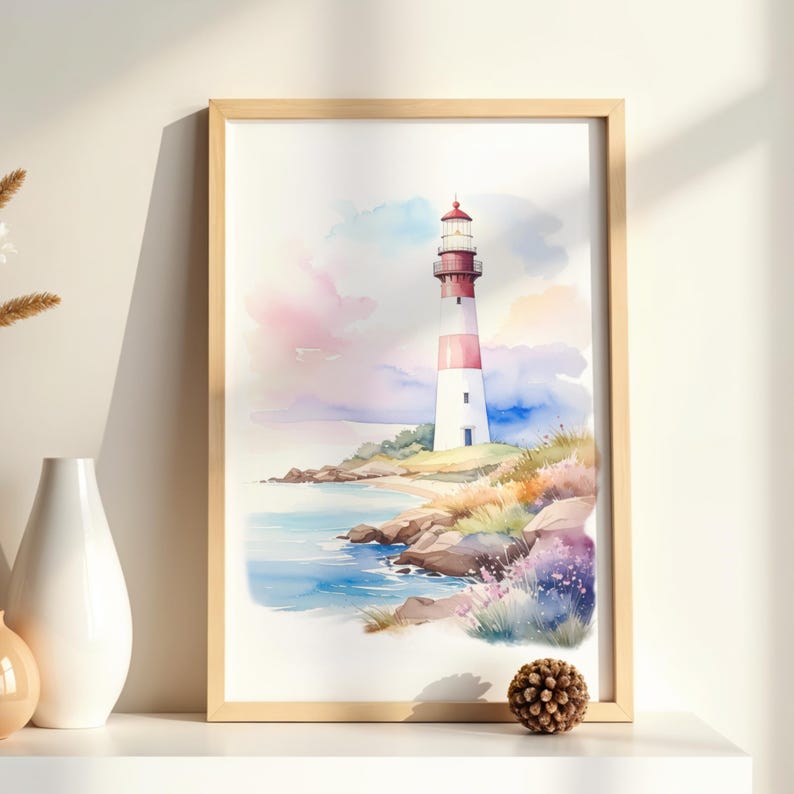 May include: Watercolor painting of a lighthouse on a rocky coastline. The lighthouse is white and red, set against a backdrop of a colorful sky and ocean. The artwork is framed in a light wood frame.