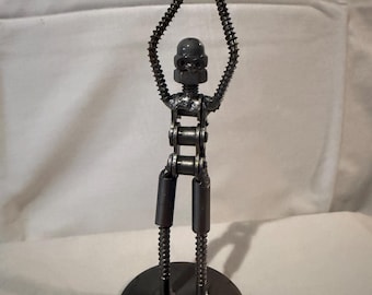 Metal sculpture basketball  player with ball made from screws, bolts chain etc