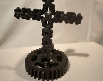 Metal cross sculpture  from metal parts gear and   chain etc