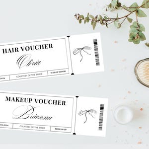 May include: Two white vouchers with black text and a bow illustration. One reads "Hair Voucher" with the name "Olivia" and "Maid of Honor." The other says "Makeup Voucher" with the name "Brianna" and "Bridesmaid."