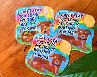 May include: Three colorful stickers with the text "I can't stay too long. My dog is waiting for me." Each sticker features a brown dog illustration with a black collar, set against a rainbow background with a yellow sun.
