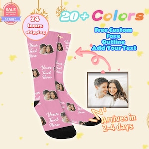May include: Pink custom socks with a photo of a couple and the text "Your Text Here". The socks have black heels and toes. The image also includes text that says "20+ Colors", "Free Custom Face Outline Add Your Text", and "Arrives in 2-4 days".