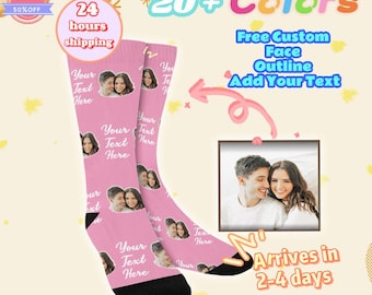 May include: Pink custom socks with a photo of a couple and the text "Your Text Here". The socks have black heels and toes. The image also includes text that says "20+ Colors", "Free Custom Face Outline Add Your Text", and "Arrives in 2-4 days".