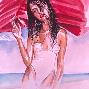 Girl on beach with umbrella