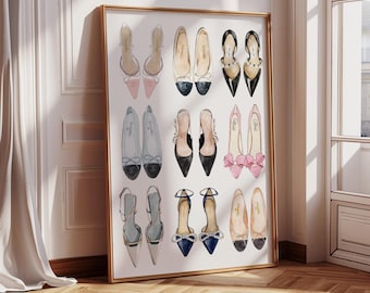 May include: A framed print featuring a collection of watercolor-style illustrations of various women's shoes. The shoes include heels, flats, and sandals in a variety of colors, including black, pink, and blue. The artwork is displayed in a gold frame.