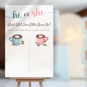 以下が含まれることがあります： イーゼルに立てられた性別発表のサイン。「he or she」の文字の上に「What Will Our Little Bean Be?」と「WRITE YOUR NAME BELOW TO CAST YOUR VOTE」の文字が書かれています。青とピンクのコーヒーカップとコーヒー豆のイラストが描かれています。