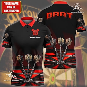 May include: A black polo shirt with a red collar and short sleeves. The front features a dartboard graphic with three darts and the text YOUR NAME. The back displays the word DART in large red letters above a dartboard graphic with three darts.