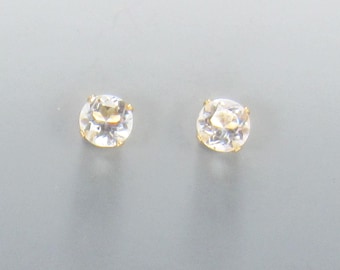 Yellow Gold Filled 6 mm White Topaz 4 prong Post Earrings with Push back Ear nuts.