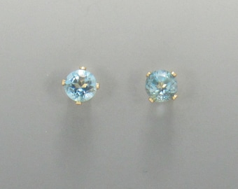 Yellow Gold Filled 5mm Blue Topaz 4 prong Post Earrings with Push back Ear nuts.