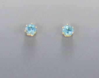 Yellow Gold Filled 4 mm Blue Topaz 6 prong Post Earrings with Push back Ear nuts.