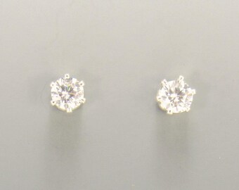 Sterling Silver 4mm Cubic Zirconia 6 prong Post Earrings with Push back Ear nuts.