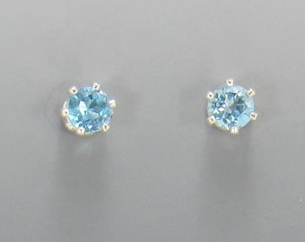 Sterling Silver 4mm Blue Topaz 6 prong Post Earrings with Push back Ear nuts.