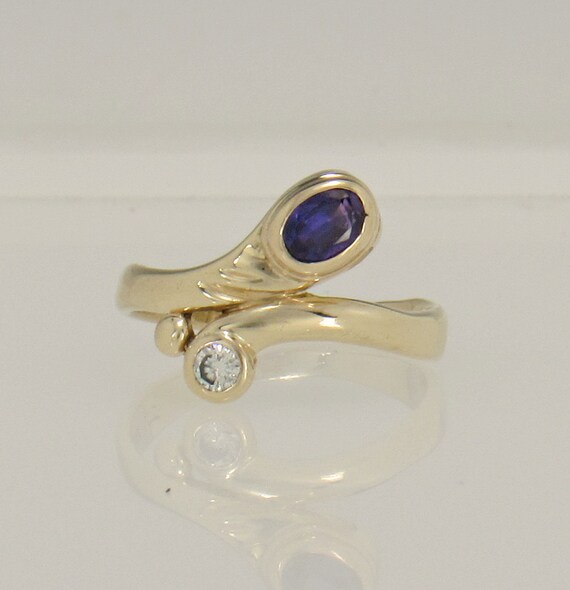 14ky Gold 6x4 mm Color change Sapphire and 3 mm Di