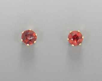 Yellow Gold Filled 4 mm Garnet 6 prong Post Earrings with Push back Ear nuts.