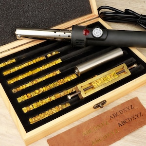 May include: A rustic wooden sign with the text "Welcome to our home" in white lettering. The sign features a distressed finish and a simple, inviting design, perfect for front door decor.