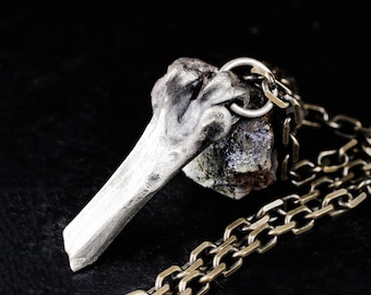 A broken femur necklace, sterling silver animal bone pendant, realistic human bone
