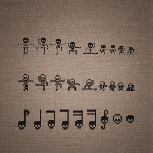 May include: A cross-stitch pattern on brown fabric featuring two rows of black pixelated skeleton figures in various poses, followed by a bottom row of black musical notes with skull heads and two separate skull icons.