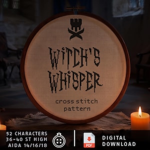 Puede incluir: Un bastidor de bordado redondo de madera que contiene un patr&oacute;n de punto de cruz sobre tela beige. El dise&ntilde;o presenta un icono de castillo negro sobre el texto WITCH'S WHISPER y las palabras cross stitch pattern. El texto inferior dice 52 CHARACTERS 36-40 ST HIGH AIDA 14/16/18.