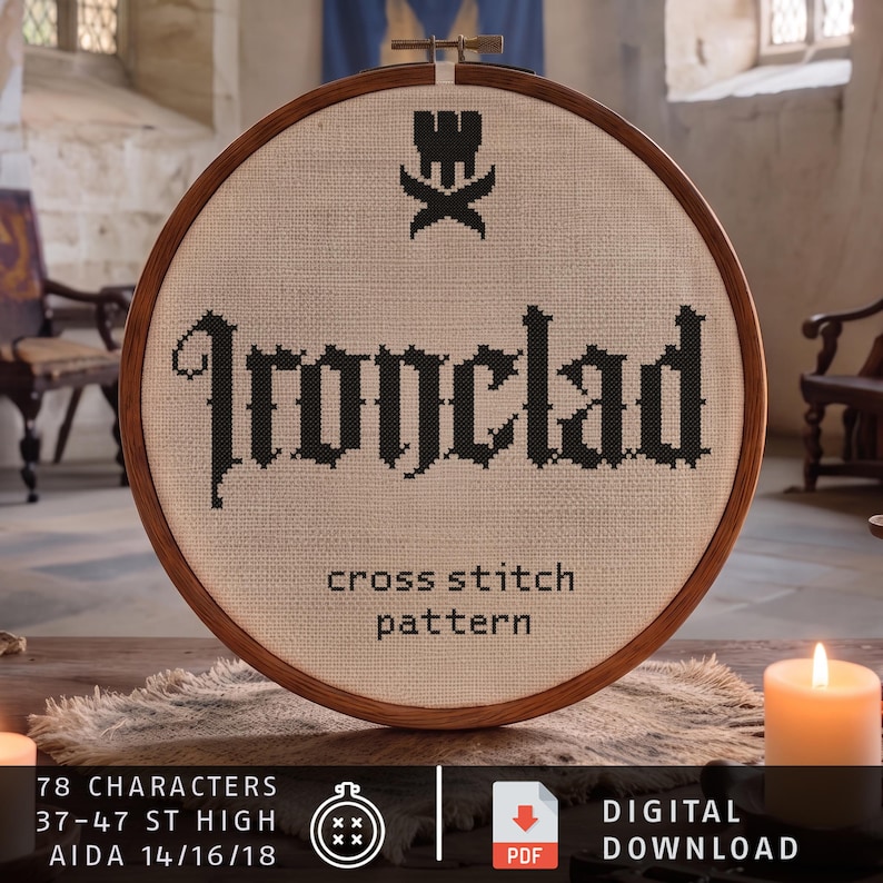 May include: A round wooden embroidery hoop containing a beige fabric with a black cross-stitch design. The text reads Ironclad with a small emblem above and the words cross stitch pattern below. The bottom includes text about 78 characters.