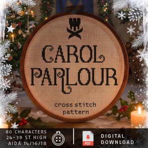 May include: A round wooden embroidery hoop containing a beige fabric with black cross-stitched text that reads CAROL PARLOUR, a small crown icon above, and the text cross stitch pattern below. The design includes 80 characters, 24-39 st high.