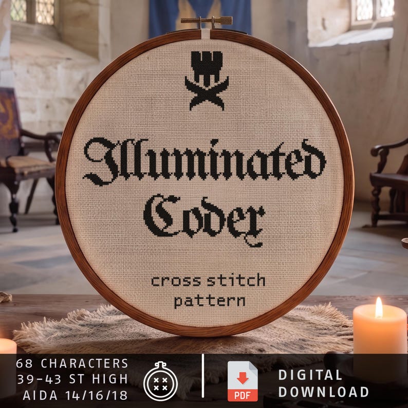 May include: A circular wooden embroidery hoop containing a cross stitch pattern on beige fabric. The design features a black castle icon above the text "Illuminated Coder" and "cross stitch pattern" in a gothic font. Text at the bottom reads 68 characters.