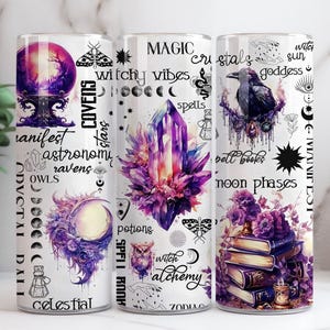 May include: Three white tumblers with celestial, witchy, and magical designs. The first tumbler features a purple crystal ball, the second a large purple crystal, and the third a raven perched on a branch. Text includes "manifest", "magic", and "crystals".