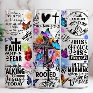 May include: Three stainless steel tumblers with inspirational quotes and religious imagery. The designs include butterflies, crosses, and floral elements. Text includes "Faith over Fear" and "Peace, love, Jesus."